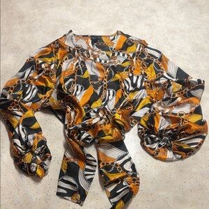 Vibrant Patterned Blouse with Chain Design